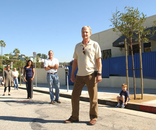 Resident Gordon Gibson coordinated sidewalk repairs and the planting of three new trees in front of Le Lycee Francais and Palisades Montessori schools on Marquez Avenue. Right to left: Gibson; David Reed of Pierre Landscaping; Angela DeSilva, director of Palisades Montessori; Catherine Leloup, director of Le Lycee; and Bob Ruhl, superintendent of Gordon Gibson Construction. Gibson's son, Henri, sits next to the tree.